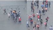 Foto ilustrativa de la nota titulada: Comerciantes ambulantes arman campal en Zócalo de la CDMX por espacios para vender (Videos)