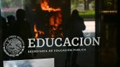 Foto ilustrativa de la nota titulada: Encapuchados irrumpen con violencia en la SEP durante la protesta de la CNTE (Video)