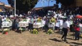 Con protesta y quema de camiones despiden a los 11 asesinados en Tangamandapio