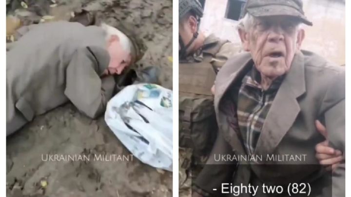 Soldados ucranianos ayudan a un anciano que se desmayó cuando buscaba comida