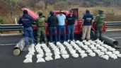 Decomisan 80 kilos de metanfetamina y armas a dos sujetos en Michoacán
