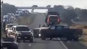 Comando cierra autopista, intercepta tráiler y roba camionetas de lujo (Video)