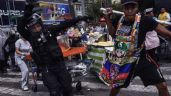 Suman ocho heridos por choque entre policías y comerciantes en Eje Central